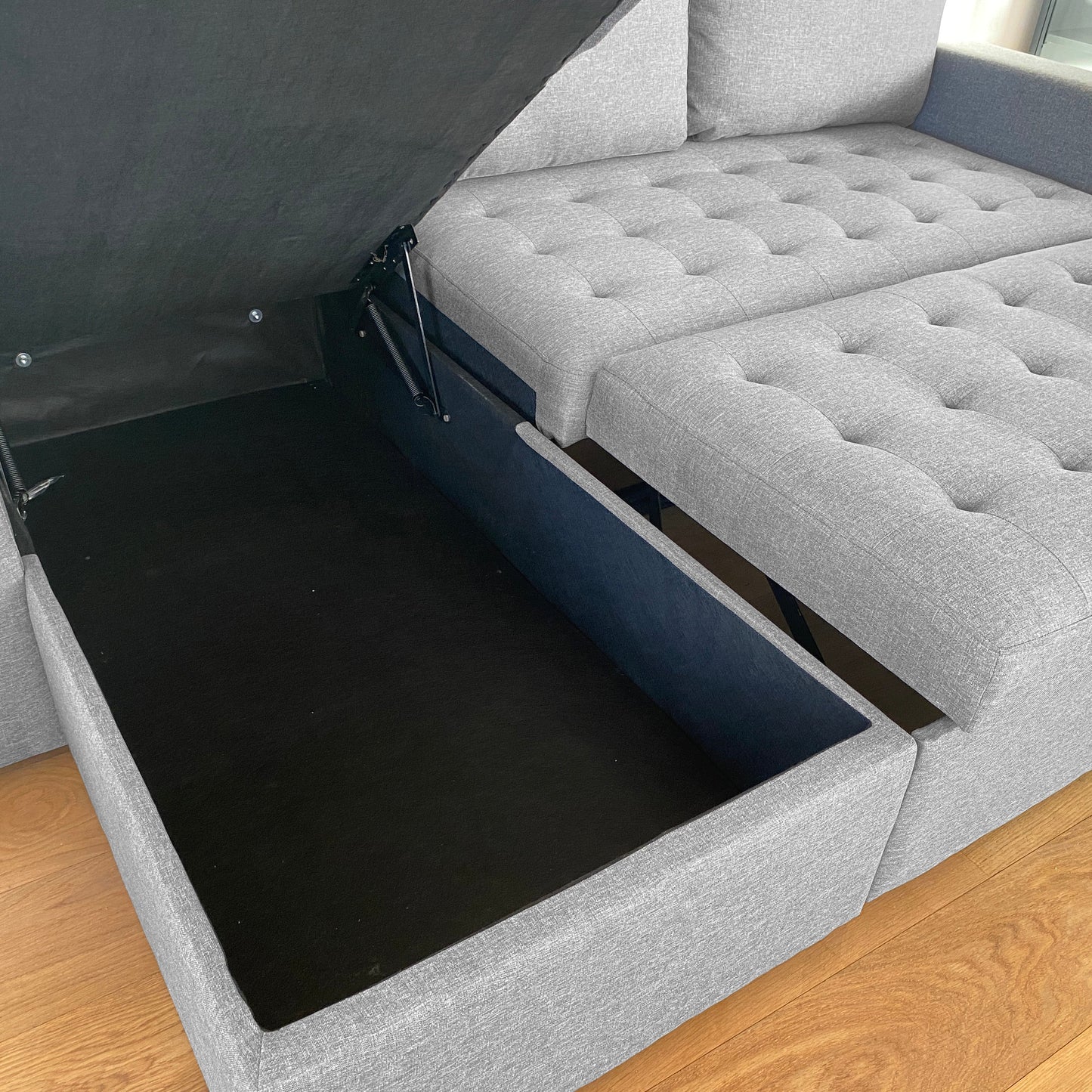 Sinus grijze slaapbank met chaise longue en opbergruimte