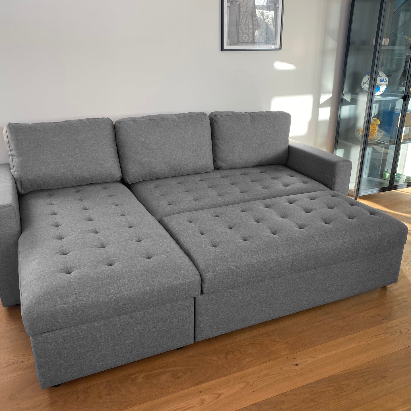 Sinus grijze slaapbank met chaise longue en opbergruimte